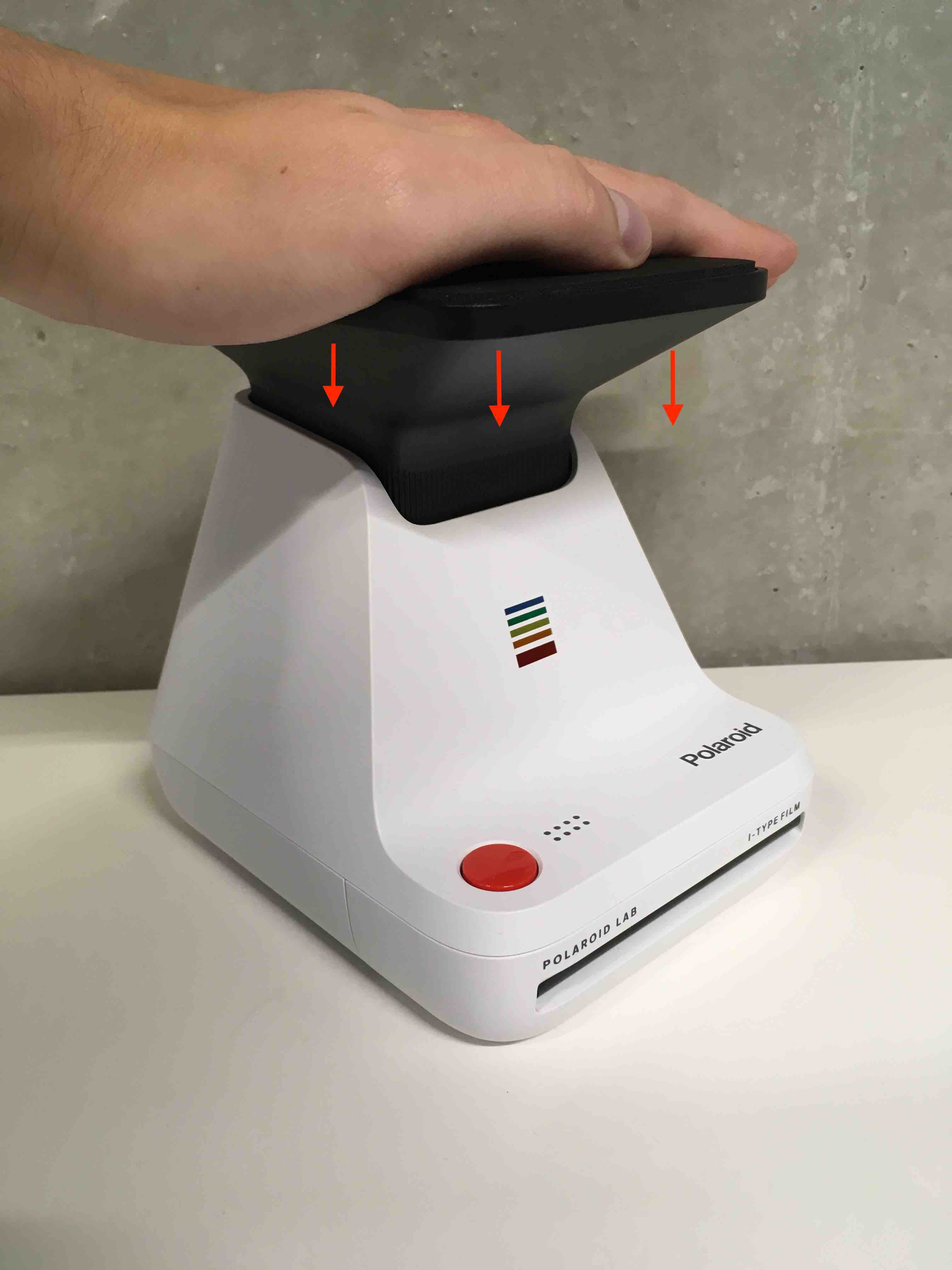 The Polaroid Lab uses the light from your phone's screen to turn